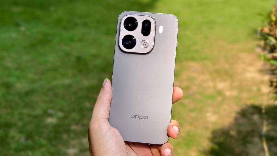 User holding the OPPO Find X9 Pro smartphone outdoors